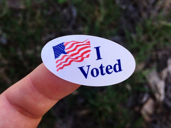Person holding a voting sticker