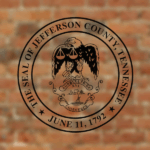 seal of jefferson county tennessee overlayed on a brick background